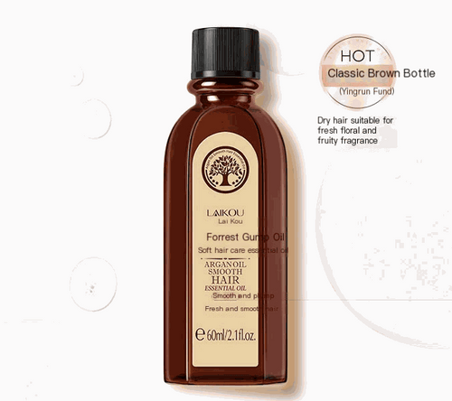 Argan Oil Hair Serum bottle next to skin rejuvenation beauty device for smooth and frizz control